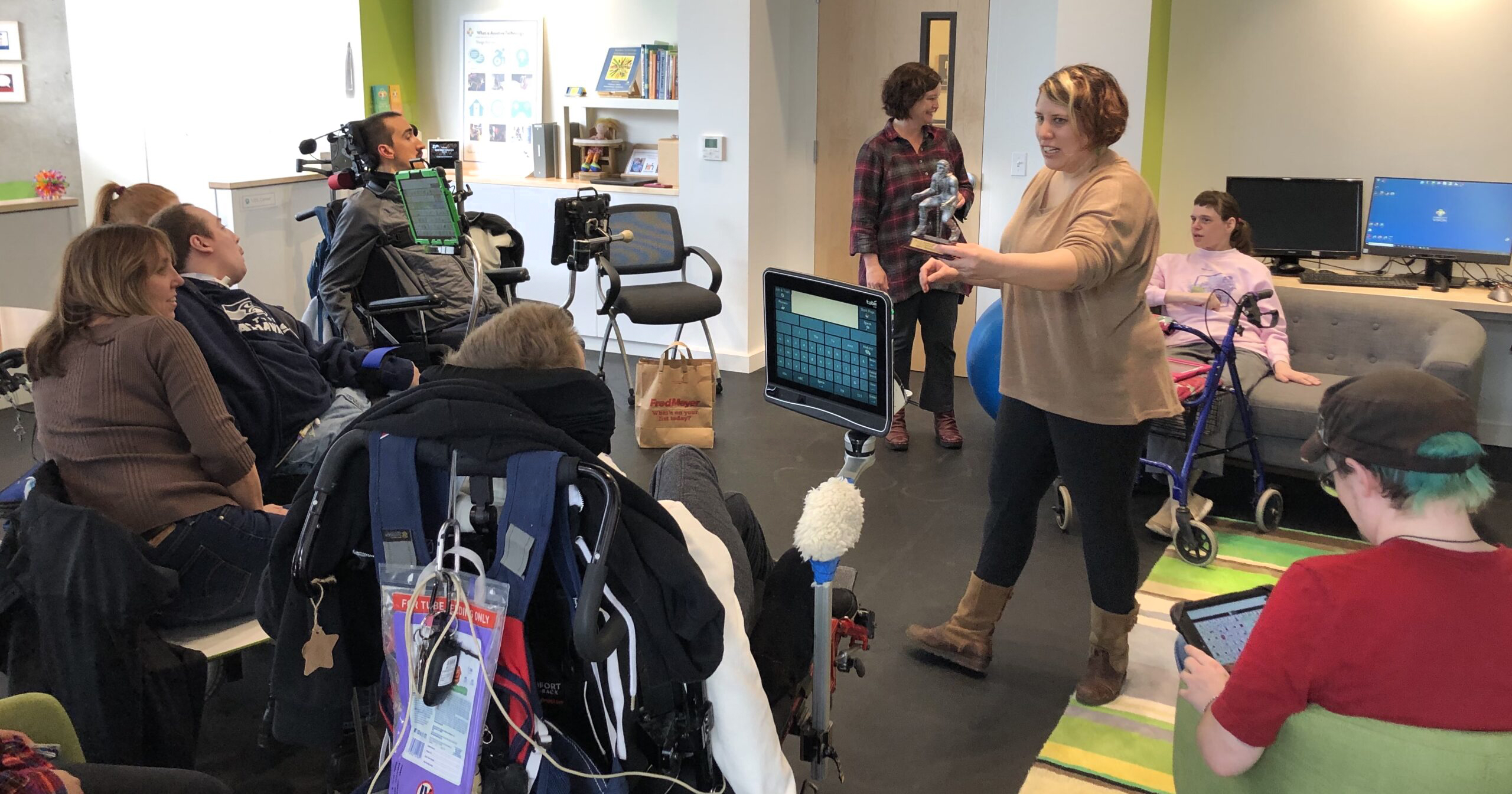 People who use AAC and support workers gathered in the AT Lab